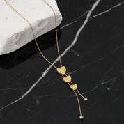 Collier pendentif trois cœurs en acier inoxydable doré